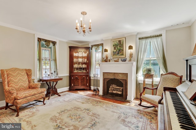 2538 Church Ln, Doylestown, PA 18902 - sitting room featuring a fireplace, crown molding, a chandelier, wood finished floors, and baseboards