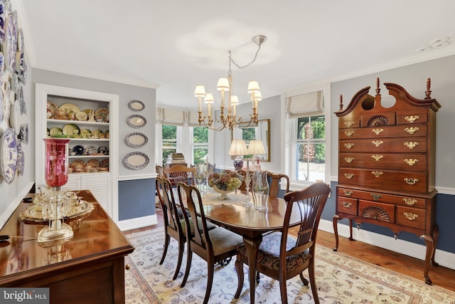 2538 Church Ln, Doylestown, PA 18902 - dining area featuring a chandelier, ornamental molding, baseboards, and light wood-style flooring