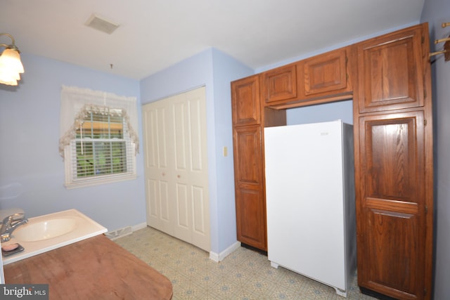 10 Eastbrooke Dr, Ephrata, PA 17522 - bathroom with tile patterned floors, vanity, and baseboards