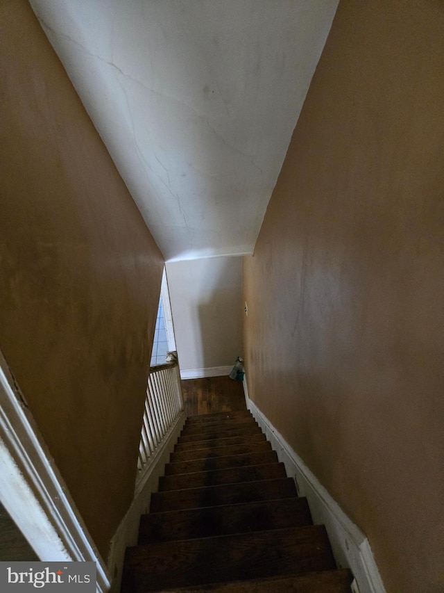 1151 E King St, York, PA 17403 - staircase featuring wood finished floors, lofted ceiling, and baseboards