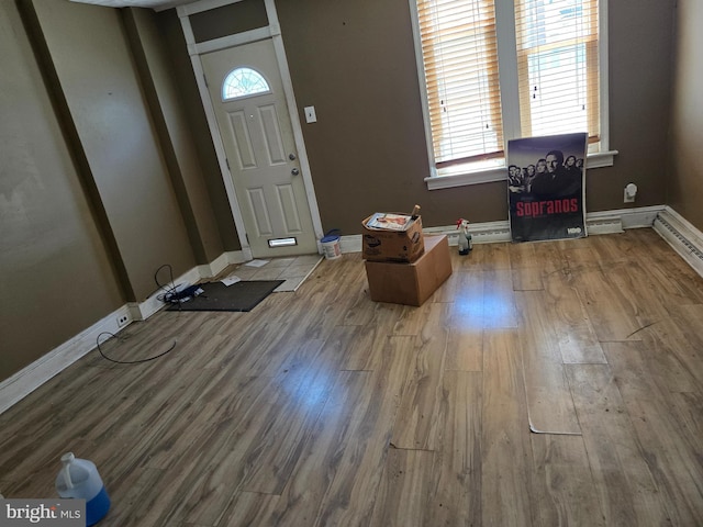 1151 E King St, York, PA 17403 - entryway with wood finished floors, baseboards, and a baseboard heating unit
