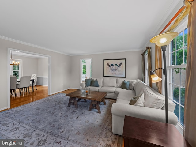 2200 Traies Ct, Alexandria, VA 22306 - living room featuring a chandelier, wood finished floors, ornamental molding, and baseboards