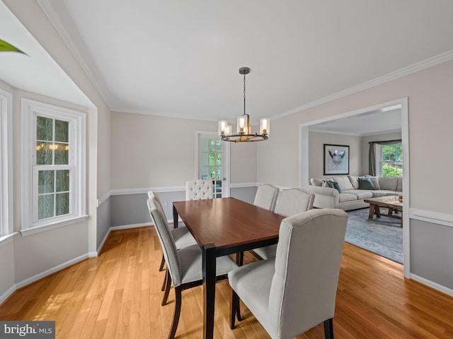 2200 Traies Ct, Alexandria, VA 22306 - dining space with a chandelier, healthy amount of natural light, crown molding, baseboards, and light wood finished floors