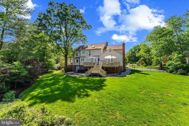 2200 Traies Ct, Alexandria, VA 22306 - rear view of property with a deck, stairway, a chimney, a patio area, and a yard