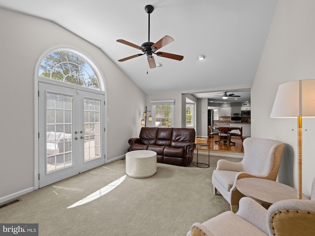 2200 Traies Ct, Alexandria, VA 22306 - living room with ceiling fan, french doors, carpet flooring, baseboards, and high vaulted ceiling