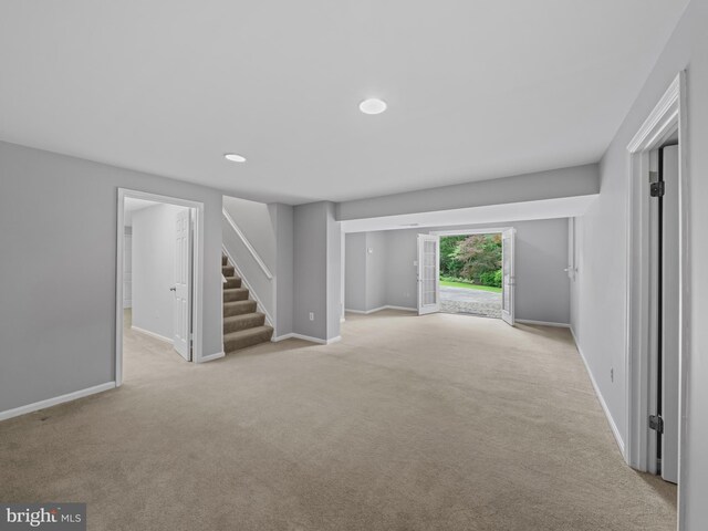 2200 Traies Ct, Alexandria, VA 22306 - unfurnished living room featuring stairs, carpet floors, baseboards, and recessed lighting