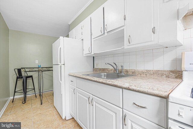 5649 Kavon Ave, Baltimore, MD 21206 - kitchen with a sink, stove, backsplash, white cabinetry, and ornamental molding