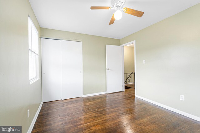 5649 Kavon Ave, Baltimore, MD 21206 - unfurnished bedroom with wood finished floors, baseboards, a closet, and a ceiling fan