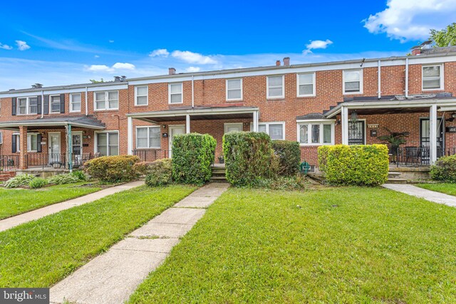 5649 Kavon Ave, Baltimore, MD 21206 - view of property with brick siding and a front yard