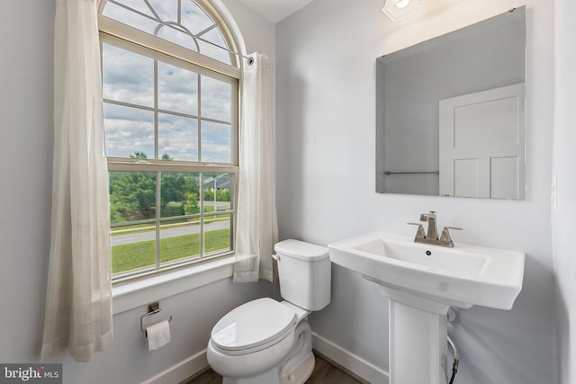14438 Mattawoman Dr Unit 5000H, Brandywine, MD 20613 - bathroom featuring toilet, baseboards, and wood finished floors