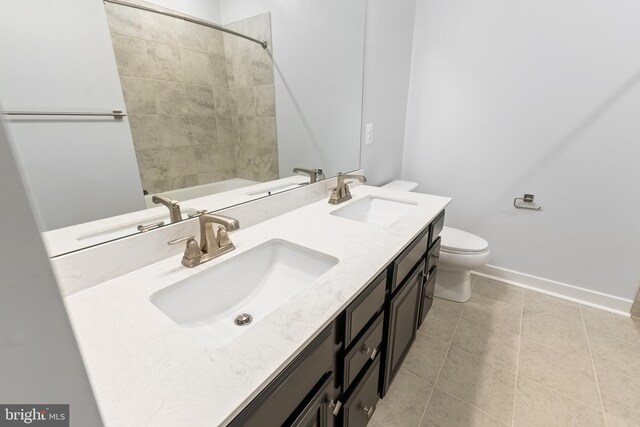 14438 Mattawoman Dr Unit 5000H, Brandywine, MD 20613 - bathroom with toilet, double vanity, tile patterned flooring, baseboards, and tub / shower combination