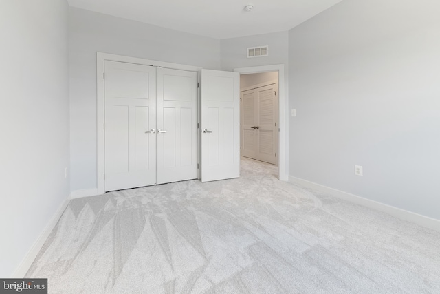 14438 Mattawoman Dr Unit 5000H, Brandywine, MD 20613 - unfurnished bedroom featuring light colored carpet, baseboards, and a closet