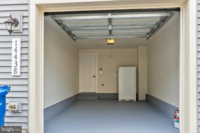 14438 Mattawoman Dr Unit 5000H, Brandywine, MD 20613 - garage featuring freestanding refrigerator and a garage door opener