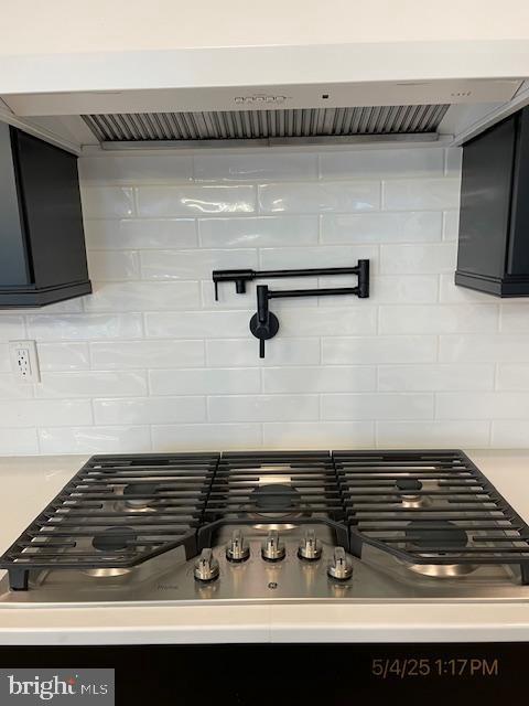 31123 Surfbird Way, Millsboro, DE 19966 - detailed view of pot filler, tasteful backsplash, stainless steel gas stovetop, and light countertops