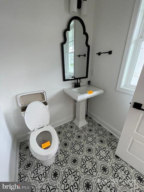 31123 Surfbird Way, Millsboro, DE 19966 - half bath featuring tile patterned flooring, baseboards, and toilet