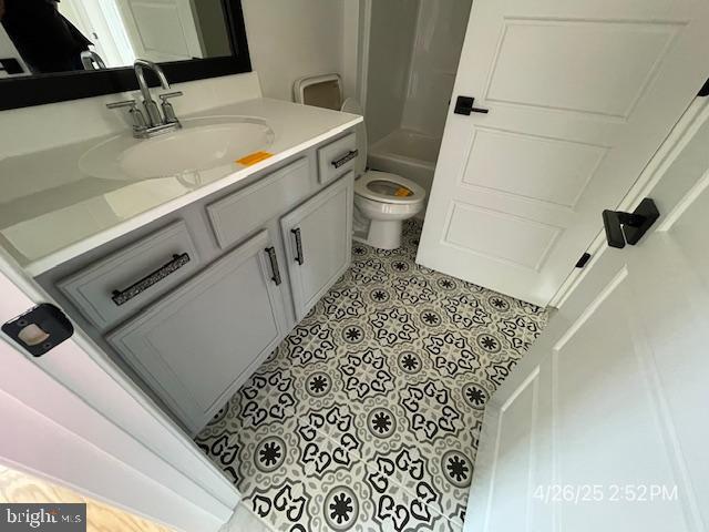 31123 Surfbird Way, Millsboro, DE 19966 - full bathroom with vanity, toilet, tile patterned flooring, and bathing tub / shower combination