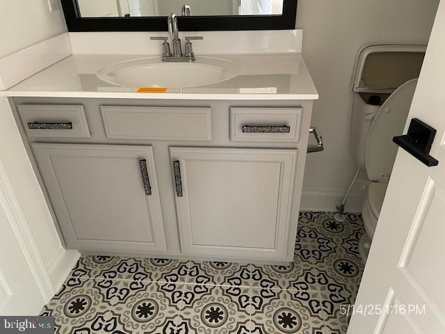 31123 Surfbird Way, Millsboro, DE 19966 - bathroom featuring tile patterned floors, vanity, toilet, and baseboards