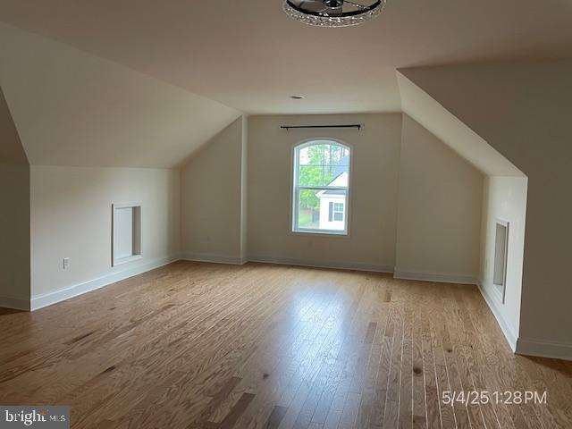 31123 Surfbird Way, Millsboro, DE 19966 - additional living space featuring wood finished floors, lofted ceiling, and baseboards