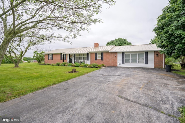 1267 Dominion Rd, Gerrardstown, WV 25420 - ranch-style home with brick siding, a chimney, driveway, a front lawn, and a standing seam roof