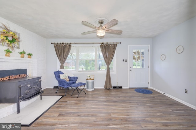 1267 Dominion Rd, Gerrardstown, WV 25420 - sitting room with ceiling fan, wood finished floors, baseboards, and a fireplace