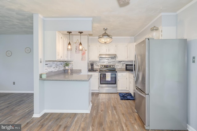 1267 Dominion Rd, Gerrardstown, WV 25420 - kitchen with appliances with stainless steel finishes, under cabinet range hood, white cabinetry, backsplash, and wood finished floors