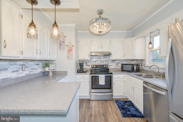1267 Dominion Rd, Gerrardstown, WV 25420 - kitchen featuring stainless steel appliances, under cabinet range hood, a sink, a chandelier, and white cabinetry