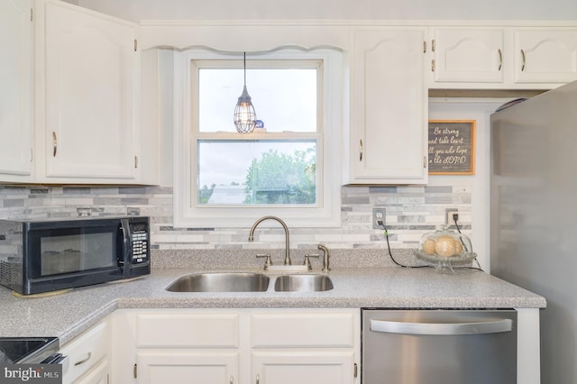 1267 Dominion Rd, Gerrardstown, WV 25420 - kitchen featuring appliances with stainless steel finishes, a sink, white cabinets, and tasteful backsplash