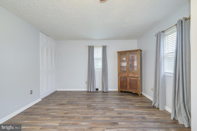 1267 Dominion Rd, Gerrardstown, WV 25420 - empty room featuring a textured ceiling, wood finished floors, and baseboards