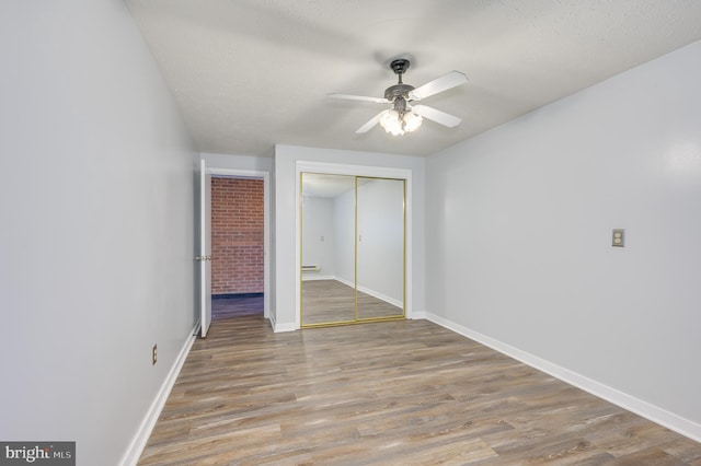 1267 Dominion Rd, Gerrardstown, WV 25420 - unfurnished bedroom with a closet, wood finished floors, and baseboards