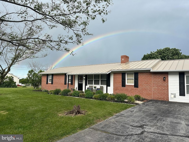 1267 Dominion Rd, Gerrardstown, WV 25420 - ranch-style home with brick siding, a standing seam roof, a front lawn, and metal roof