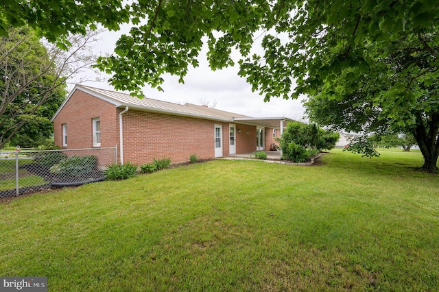 1267 Dominion Rd, Gerrardstown, WV 25420 - back of house with brick siding, metal roof, a patio area, and a standing seam roof