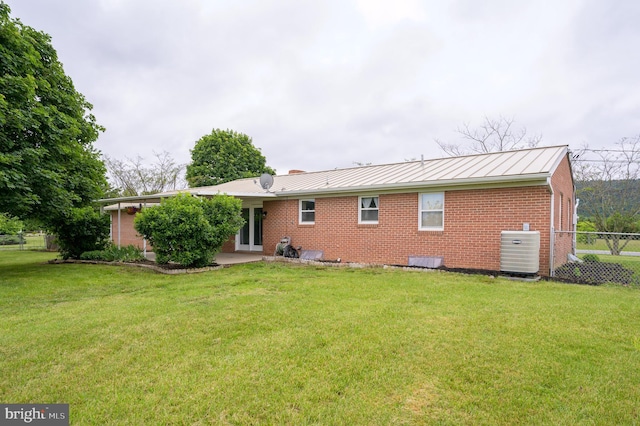 1267 Dominion Rd, Gerrardstown, WV 25420 - rear view of property with cooling unit, brick siding, a standing seam roof, and metal roof