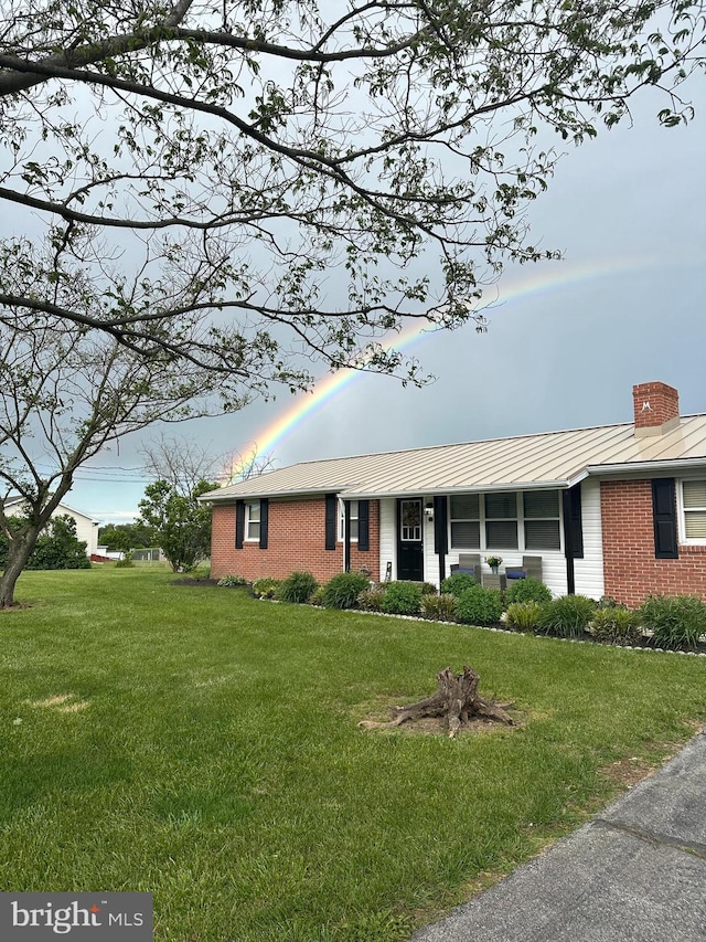 1267 Dominion Rd, Gerrardstown, WV 25420 - ranch-style home with brick siding, a front lawn, a chimney, and a standing seam roof