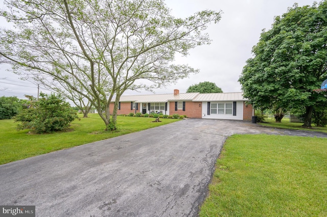 1267 Dominion Rd, Gerrardstown, WV 25420 - ranch-style house with asphalt driveway, a chimney, brick siding, a front yard, and metal roof