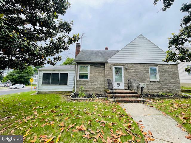 534 Blanchard Ave, Runnemede, NJ 08078 - bungalow-style house with a chimney, a front lawn, and stone siding