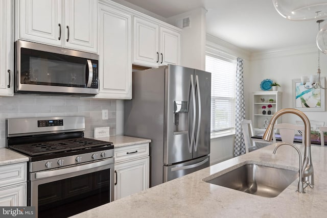 20093 Old Salt Ln, Frankford, DE 19945 - kitchen featuring stainless steel appliances, a sink, white cabinets, tasteful backsplash, and light stone counters