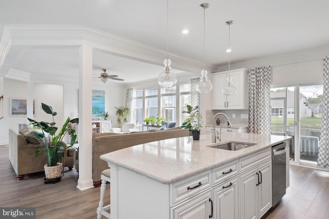 20093 Old Salt Ln, Frankford, DE 19945 - kitchen featuring a sink, dishwasher, healthy amount of natural light, white cabinetry, and ornamental molding