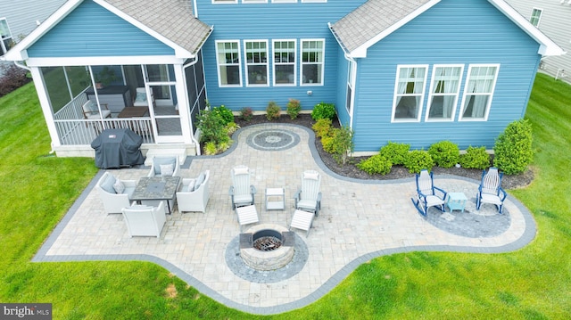 20093 Old Salt Ln, Frankford, DE 19945 - back of property featuring an outdoor fire pit, a patio, a yard, a sunroom, and a shingled roof