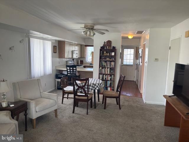 101 11th St N # A, Brigantine, NJ 08203 - dining room with a ceiling fan, baseboards, and carpet flooring