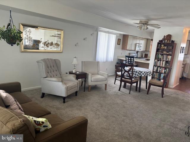 101 11th St N # A, Brigantine, NJ 08203 - carpeted living room with a ceiling fan and baseboards