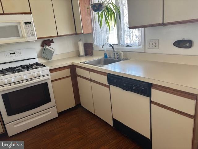101 11th St N # A, Brigantine, NJ 08203 - kitchen with white appliances, light countertops, a sink, and dark wood-style floors