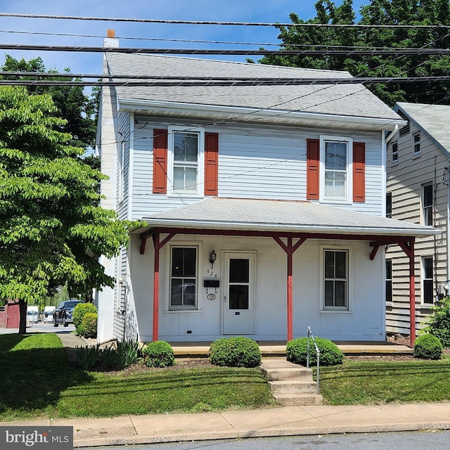 528 N State St, Ephrata, PA 17522 - view of front of house with roof with shingles, a porch, and a front lawn
