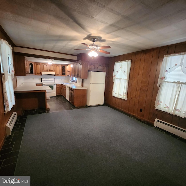 528 N State St, Ephrata, PA 17522 - kitchen featuring white appliances, a baseboard heating unit, ventilation hood, a sink, and wooden walls