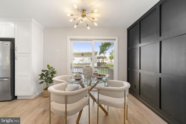 112 Morris Ave, Woodlyn, PA 19094 - dining space featuring a chandelier, light wood-style floors, and baseboards