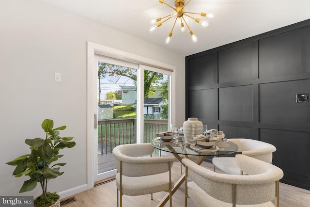 112 Morris Ave, Woodlyn, PA 19094 - dining space featuring a chandelier, light wood-style floors, and baseboards