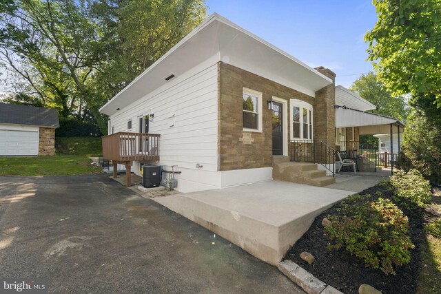 112 Morris Ave, Woodlyn, PA 19094 - back of house featuring central AC unit and an outdoor structure