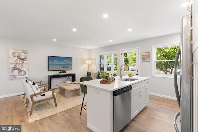 112 Morris Ave, Woodlyn, PA 19094 - kitchen featuring appliances with stainless steel finishes, a sink, an island with sink, white cabinetry, and recessed lighting