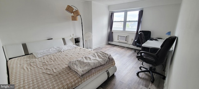 3817 Ventnor Ave Unit 311, Atlantic City, NJ 08401 - bedroom with an office area, wood finished floors, and baseboard heating