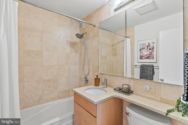 1615 Q St NW Unit 214, Washington, DC 20009 - full bathroom with shower / tub combo with curtain, backsplash, vanity, and tile walls