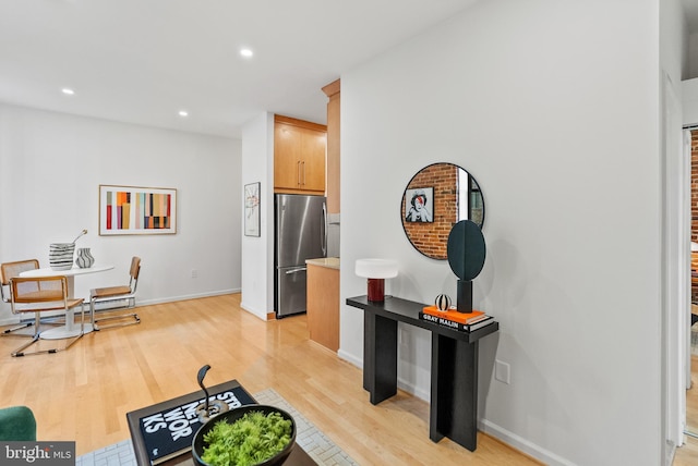1615 Q St NW Unit 214, Washington, DC 20009 - kitchen featuring freestanding refrigerator, light wood-style flooring, recessed lighting, and light countertops